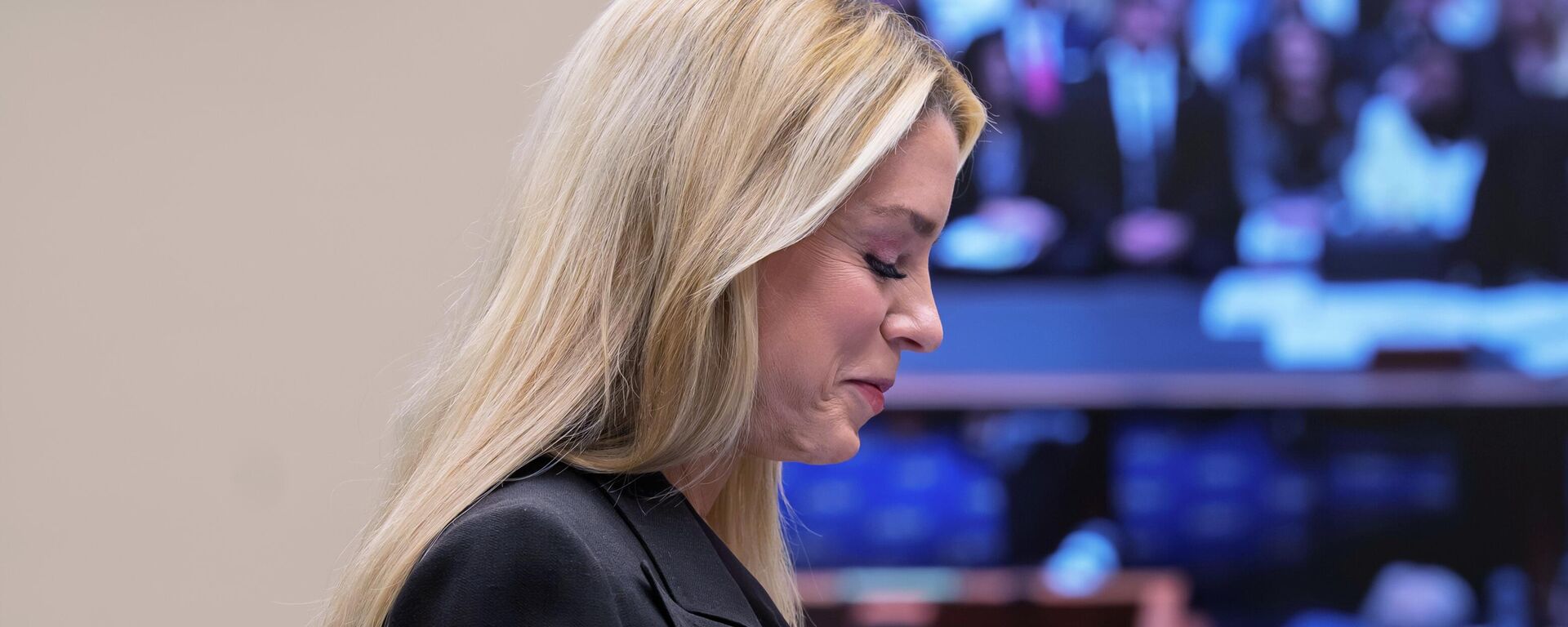 Attorney General Pam Bondi, the nation's top law enforcement officer, smiles as she prepares to face questions in the House Judiciary Committee over the Justice Department's handling of files related to convicted sex offender Jeffrey Epstein that have exposed sensitive private information about victims despite redaction efforts, at the Capitol in Washington, Wednesday, Feb. 11, 2026 - Sputnik International, 1920, 16.02.2026
