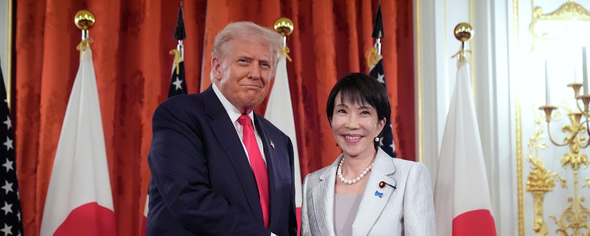 President Donald Trump, left, and Japan's Prime Minister Sanae Takaichi shake hands during a signing ceremony at Akasaka Palace in Tokyo, Japan, Tuesday, Oct. 28, 2025 - Sputnik International, 1920, 18.02.2026