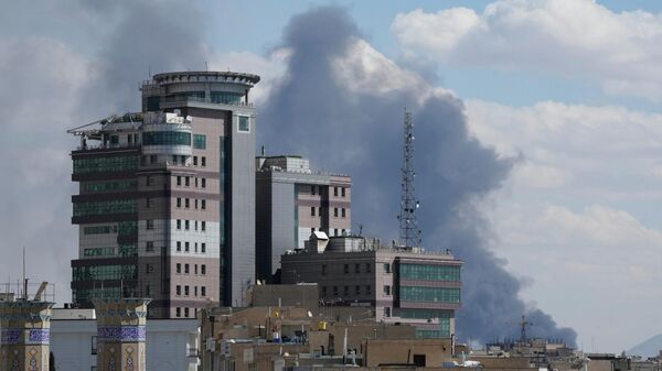 Smoke rises up after a strike in Tehran, Iran, Sunday, March 1, 2026.  - Sputnik International