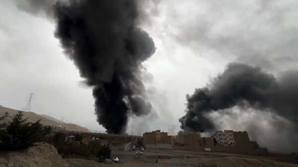 Black smoke rises over Tehran after US-Israeli strike on Shahran oil depot - Sputnik International