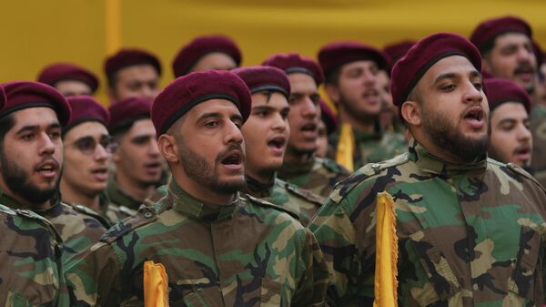 Hezbollah fighters chant during the funeral procession of the group's chief of staff, Haytham Tabtabai, and two other Hezbollah members killed in Sunday's Israeli airstrike, in a southern suburb of Beirut, Lebanon, Monday, Nov. 24, 2025.  - Sputnik International