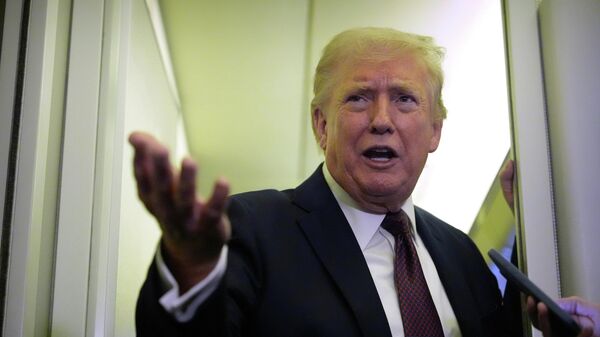 President Donald Trump speaks to reporters aboard Air Force One, Sunday, March 15, 2026, en route from West Palm Beach, Fla. to Joint Base Andrews, Md. - Sputnik International