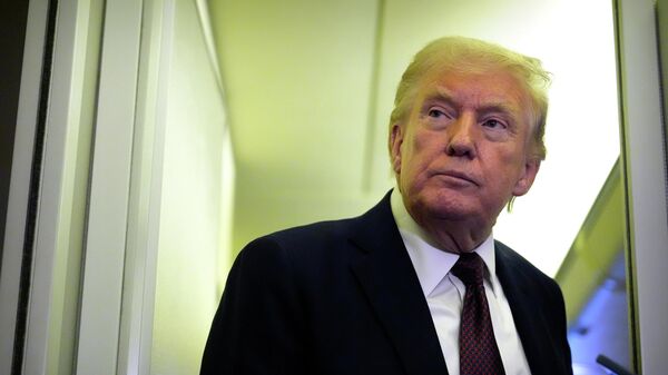 President Donald Trump speaks to reporters aboard Air Force One, Sunday, March 15, 2026, en route from West Palm Beach, Fla. to Joint Base Andrews, Md. - Sputnik International