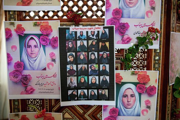 Portraits of school children from the Shajarah Tayyebeh Elementary School in Minab, who were killed in a U.S strike are displayed during a press conference by Iranian Ambassador to Tunisia Massoud Hosseinian, in Tunis, Tunisia, Thursday, March 12, 2026. (AP Photo/Ons Abid) - Sputnik International