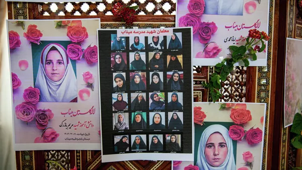 Portraits of school children from the Shajarah Tayyebeh Elementary School in Minab, who were killed in a U.S strike are displayed during a press conference by Iranian Ambassador to Tunisia Massoud Hosseinian, in Tunis, Tunisia, Thursday, March 12, 2026. (AP Photo/Ons Abid) - Sputnik International