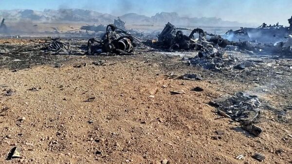 In this image provided by Sepahnews, the Iranian Revolutionary Guard's official website, wreckage is shown at what Iran's state TV said was the site of a downed American transport plane and two helicopters involved in a rescue operation, in Isfahan province, Iran, April, 2026.  - Sputnik International