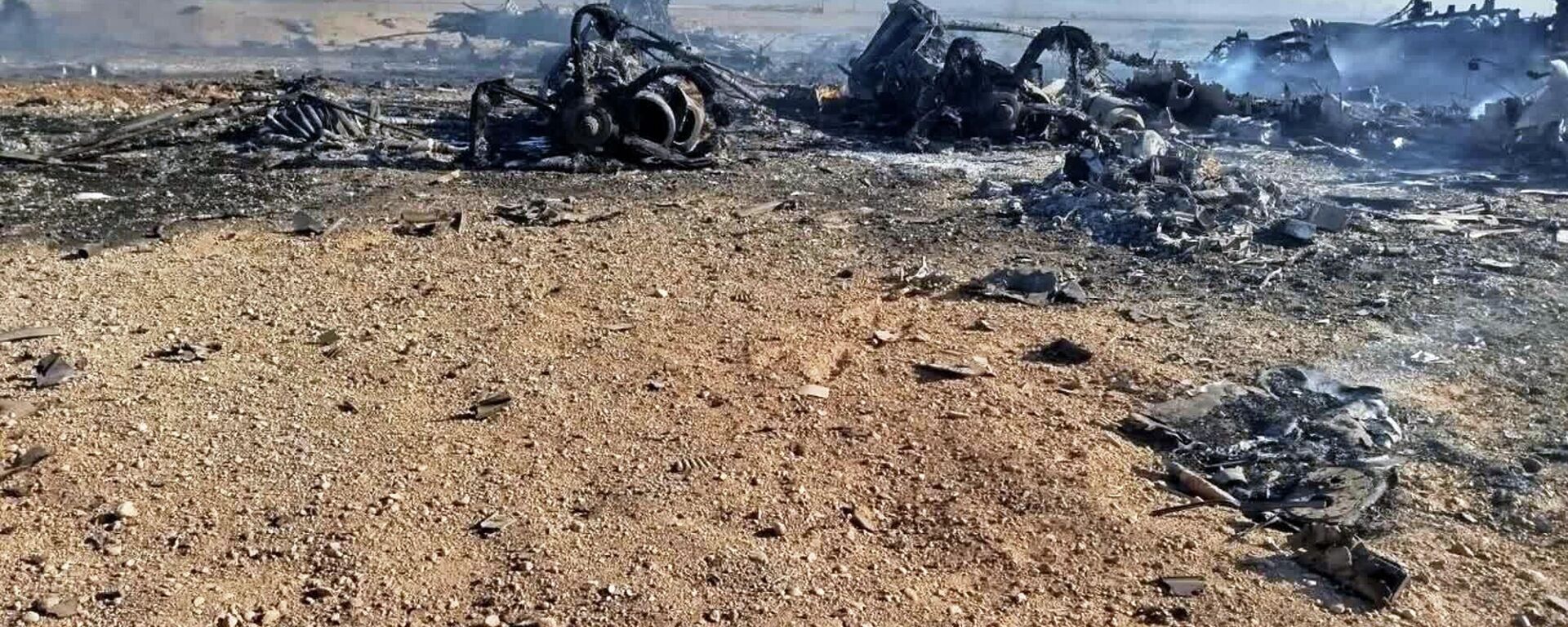 In this image provided by Sepahnews, the Iranian Revolutionary Guard's official website, wreckage is shown at what Iran's state TV said was the site of a downed American transport plane and two helicopters involved in a rescue operation, in Isfahan province, Iran, April, 2026.  - Sputnik International, 1920, 05.04.2026