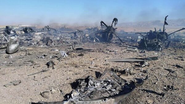 In this image provided by Sepahnews, the Iranian Revolutionary Guard's official website, wreckage is shown at what Iran's state TV claimed was the site of a downed American transport plane and two helicopters involved in a rescue operation, in Isfahan province, Iran, April, 2026 - Sputnik International