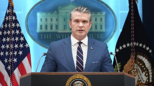 Defense Secretary Pete Hegseth speaks with reporters during a news conference with President Donald Trump in the James Brady Press Briefing Room at the White House, Monday, April 6, 2026, in Washington. (AP Photo/Mark Schiefelbein) - Sputnik International