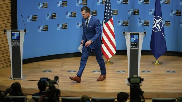 US Secretary of War Pete Hegseth leaves the stage after addressing a media conference at a meeting of NATO defense ministers at NATO headquarters in Brussels, Feb. 13, 2025.  - Sputnik International