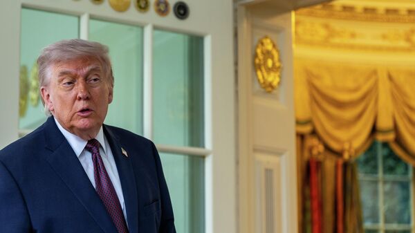 President Donald Trump speaks with reporters outside the Oval Office of the White House, Monday, April 13, 2026, in Washington.  - Sputnik International
