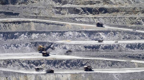Ore is hauled from the Kennecott's Bingham Canyon Copper Mine Wednesday, May 11, 2022, in Herriman, Utah. Rio  The Utah copper mining company will begin manufacturing, tellurium, a rare mineral used in solar panels that used to be discarded along with the other mine tailings. The company says it is one of two in the U.S. to produce the tellurium, which is listed as a “critical mineral” by the U.S. government.  (AP Photo/Rick Bowmer) - Sputnik International
