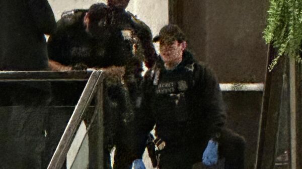 Members of law enforcement control shooting suspect Cole Tomas Allen during the White House Correspondents Dinner, Saturday, April 25, 2026, in Washington.  - Sputnik International