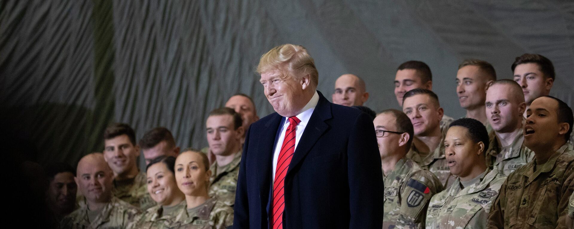 In this Nov. 28, 2019, file photo President Donald Trump smiles before addressing members of the military during a surprise Thanksgiving Day visit at Bagram Air Field, Afghanistan - Sputnik International, 1920, 15.05.2026
