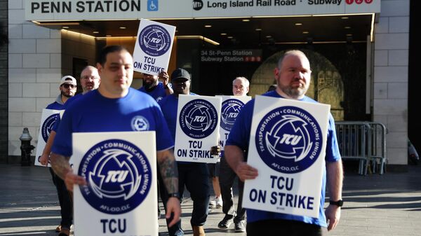 Long Island Rail Road workers walk on the picket line outside of Penn Station on the first day of their strike, Saturday, May 16, 2026, in New York - Sputnik International