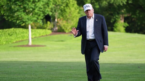 President Donald Trump walks across the South Lawn of the White House, Friday, May 15, 2026, in Washington, on return from Beijing where he met with China's President Xi Jinping - Sputnik International