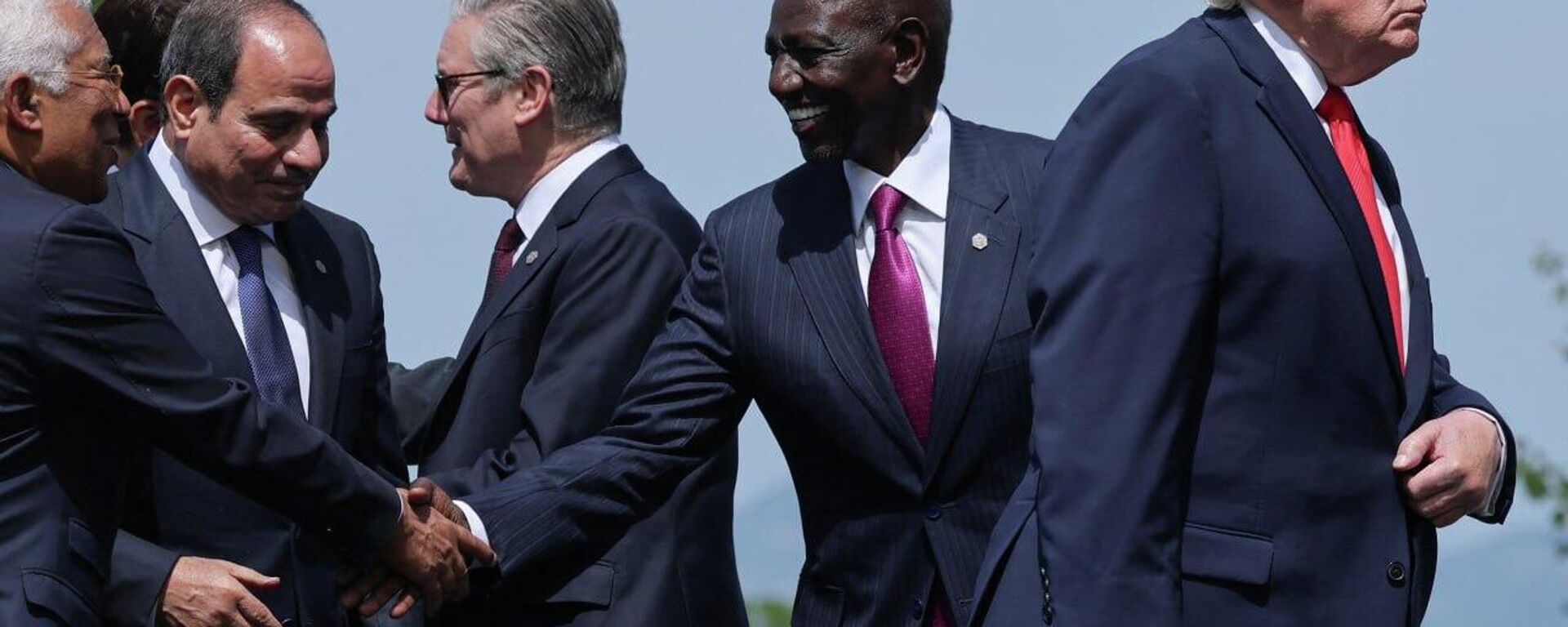 US President Donald Trump, European Council President Antonio Costa, Egyptian President Abdel Fattah al-Sisi, Kenya's President William Ruto and British Prime Minister Keir Starmer attend a family photo session during the G7 summit in France on June 16, 2026.  - Sputnik International, 1920, 17.06.2026