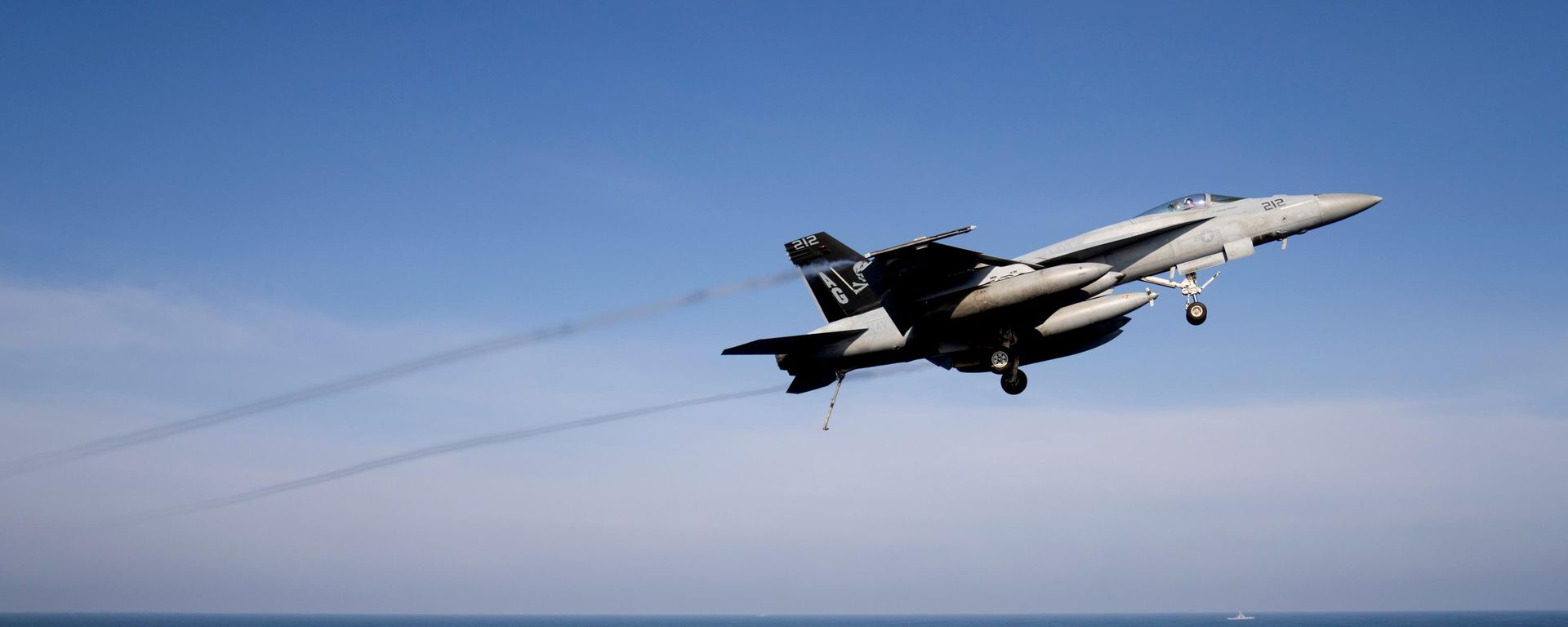 An F/A-18 Super Hornet fighter jet flies over the deck of the nuclear-powered aircraft carrier USS George Washington during joint exercises, off the coast of Argentina, Thursday, May 30, 2024 - Sputnik International, 1920, 14.07.2026