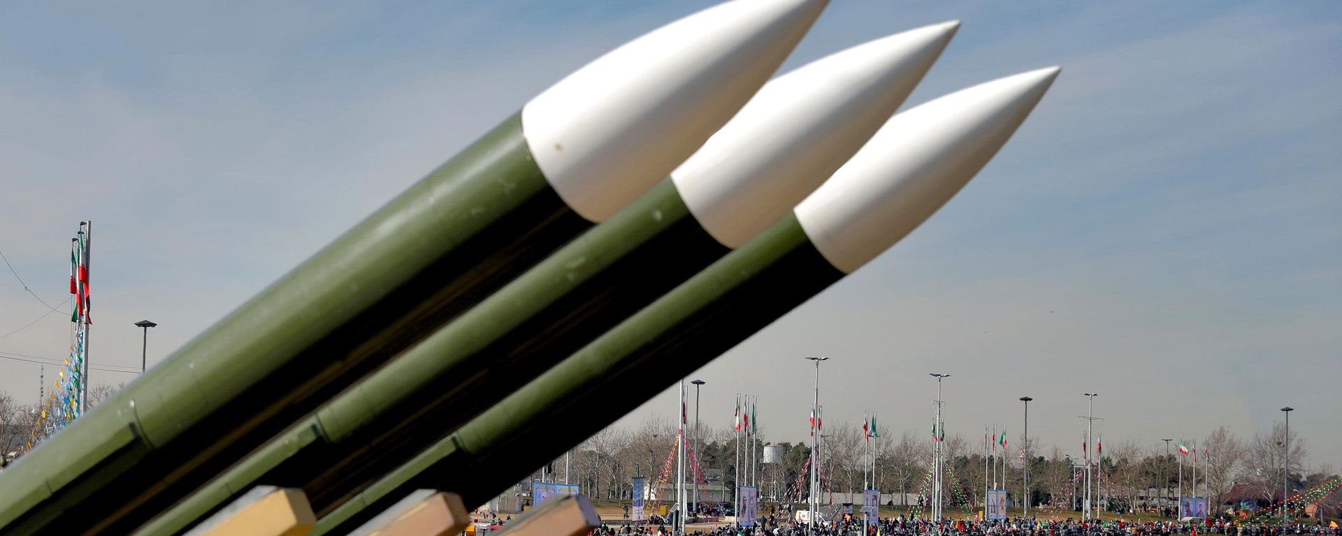 Iranians drive past missiles by their motorcycles during a rally marking the 42nd anniversary of the Islamic Revolution, at Azadi (Freedom) Square in Tehran, Iran, Wednesday, Feb. 10, 2021 - Sputnik International, 1920, 26.07.2026
