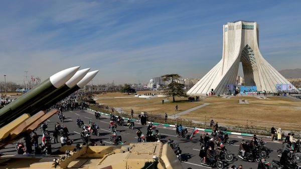 ranians drive past missiles by their motorcycle during a rally marking the 42nd anniversary of the Islamic Revolution, at Azadi (Freedom) Square in Tehran, Iran, Wednesday, Feb. 10, 2021 - Sputnik International