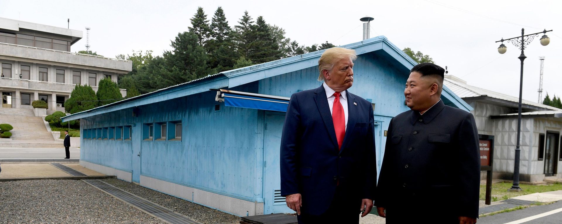 In this June 30, 2019, file photo, US President Donald Trump, left, meets with North Korean leader Kim Jong-un at the border village of Panmunjom in Demilitarized Zone, South Korea - Sputnik International, 1920, 04.08.2026