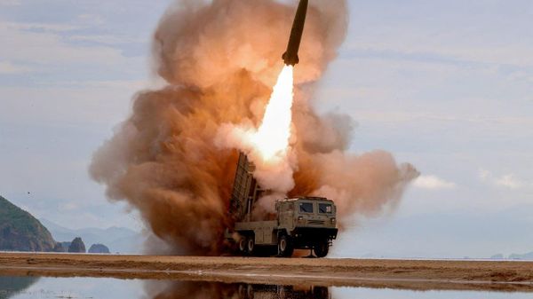 A rocket launcher fires a munition during tests, involving an upgraded version of a 240-mm, 24-tube multiple rocket launcher system, tactical ballistic missiles, and a 155-mm self-propelled howitzer, overseen by North Korean leader Kim Jong Un in North Korea, June 25, 2026. - Sputnik International