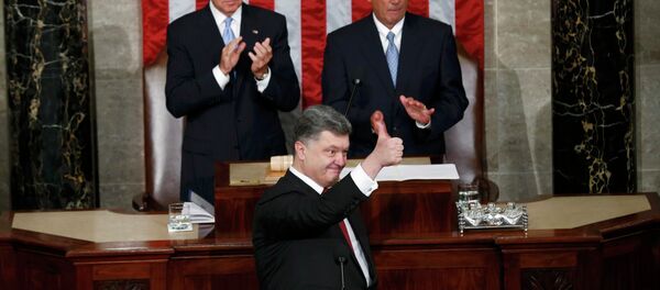 Ukraine President Petro Poroshenko gestures while addressing a joint meeting of Congress in the US Capitol in Washington, September 18, 2014 Ukraine President Petro Poroshenko gestures while addressing a joint meeting of Congress in the US Capitol in Washington, September 18, 2014 - Sputnik International