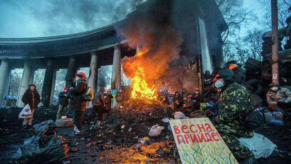 KIEV, UKRAINE - JANUARY 24: Barricade with the protesters at Hrushevskogo street on January 26, 2014 in Kiev, Ukraine. The anti-governmental protests turned into violent clashes during last week - Sputnik International