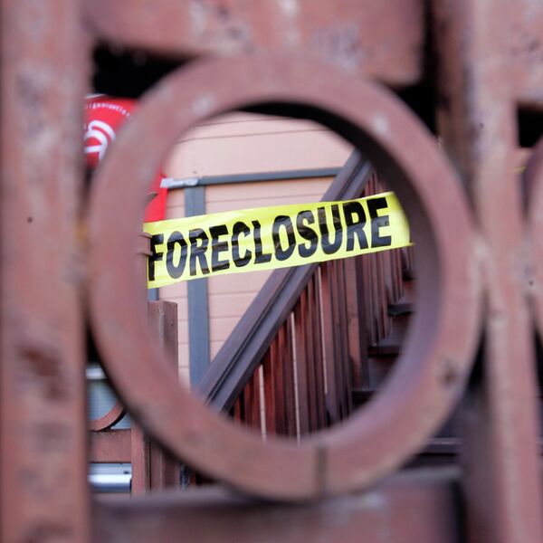 Foreclosure sign shown through a front gate of a foreclosed home in Oakland, California Foreclosure sign shown through a front gate of a foreclosed home in Oakland, California - Sputnik International