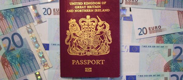 UK biometric passport on pile of Euro currency UK biometric passport on pile of Euro currency - Sputnik International