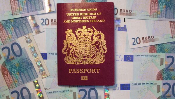 UK biometric passport on pile of Euro currency - Sputnik International
