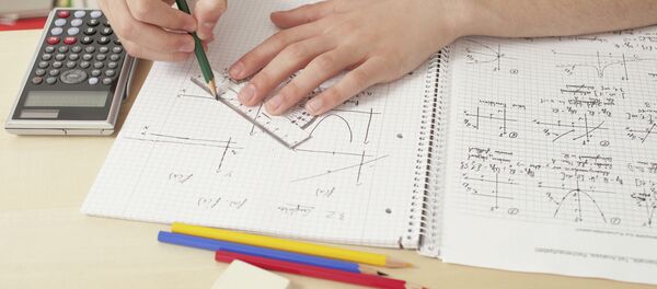 Close up of teenager doing math’s homework - Sputnik International