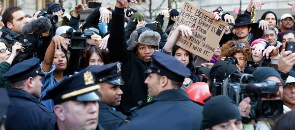Occupy Wall Street protestors show they disapprove of police demanding that drums not be played in Zuccotti park due to a noise complaint from nearby residents on Thanksgiving day, Thursday, Nov. 24, 2011, in New York. Although the crowd insisted they had a right to play, the drummer in question opted to refrain from playing to avoid a confrontation with police. Occupy Wall Street protestors show they disapprove of police demanding that drums not be played in Zuccotti park due to a noise complaint from nearby residents on Thanksgiving day, Thursday, Nov. 24, 2011, in New York. Although the crowd insisted they had a right to play, the drummer in question opted to refrain from playing to avoid a confrontation with police. - Sputnik International