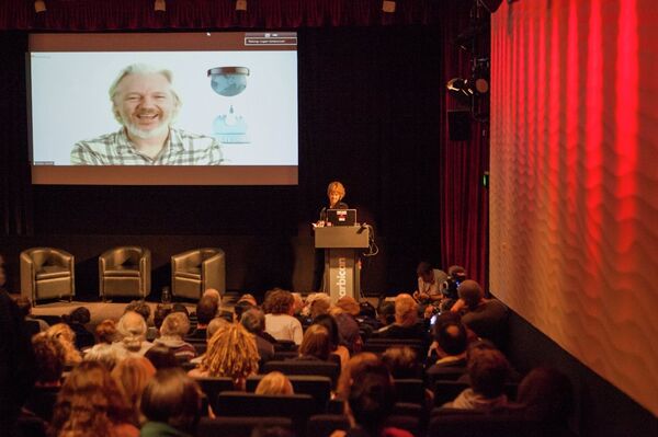 Julian Assange joining the Logan Symposium by video link Julian Assange joining the Logan Symposium by video link - Sputnik International