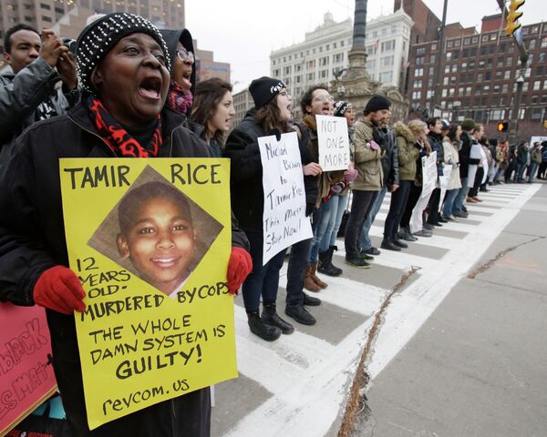 Demonstrators block Public Square Tuesday, Nov. 25, 2014, in Cleveland, during a protest over the weekend police shooting of Tamir Rice. The 12-year-old was fatally shot by a Cleveland police officer Saturday after he reportedly pulled a replica gun at the city park. - Sputnik International