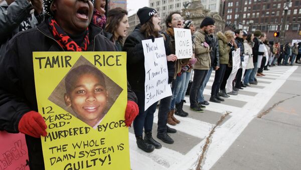 Demonstrators block Public Square Tuesday, Nov. 25, 2014, in Cleveland, during a protest over the weekend police shooting of Tamir Rice. The 12-year-old was fatally shot by a Cleveland police officer Saturday after he reportedly pulled a replica gun at the city park. - Sputnik International