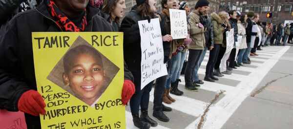 Demonstrators block Public Square Tuesday, Nov. 25, 2014, in Cleveland, during a protest over the weekend police shooting of Tamir Rice. The 12-year-old was fatally shot by a Cleveland police officer Saturday after he reportedly pulled a replica gun at the city park. - Sputnik International