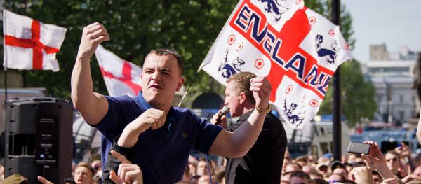 A supporter of the far-right English Defence League (EDL) gestures near Downing Street in central London A supporter of the far-right English Defence League (EDL) gestures near Downing Street in central London - Sputnik International