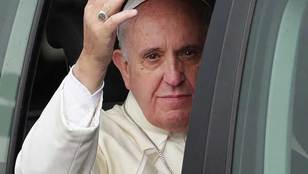 Pope Francis waves from his vehicle - Sputnik International