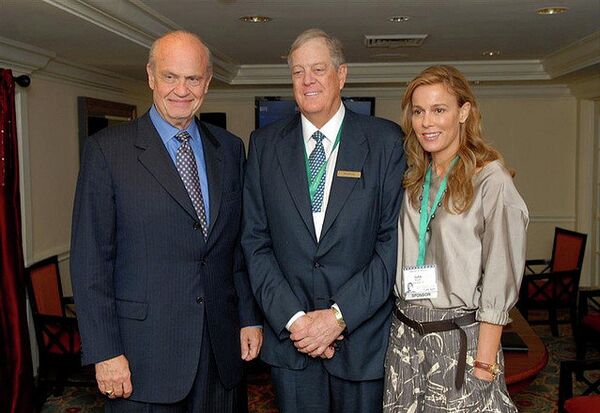 David Koch (center) with wife Julia and Fred Thompson. David Koch (center) with wife Julia and Fred Thompson. - Sputnik International