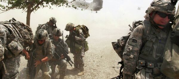 US Soldiers wait for the CH-47 Chinook helicopter to land so they can depart from an air-assault mission during Operation Champion Sword to search Khost province, Afghanistan, July 28, 2009. Afghan national security forces and International Security Assistance Forces teamed up to focus on specific militant targets and safe havens within Sabari and Terezai districts. US Soldiers wait for the CH-47 Chinook helicopter to land so they can depart from an air-assault mission during Operation Champion Sword to search Khost province, Afghanistan, July 28, 2009. Afghan national security forces and International Security Assistance Forces teamed up to focus on specific militant targets and safe havens within Sabari and Terezai districts. - Sputnik International