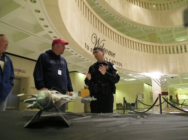 John Porgal speaks with police after his display was damaged. - Sputnik International