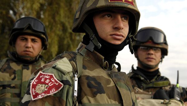 Iraqi army Emergency Services Unit soldiers provide security during an operation in the Al Mora village, Kirkuk, Iraq, March 4, 2007. - Sputnik International