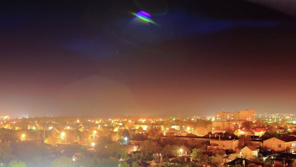 A late evening shot of a UFO taken on May 18, 2014. - Sputnik International