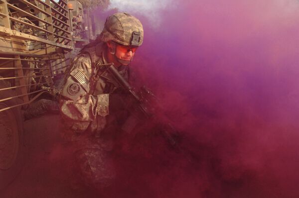 A U.S. Army Soldier from the 3rd Squadron, 2nd Stryker Cavalry Regiment conceals himself with smoke Oct. 18, 2007, after one of his regiment\'s vehicles was hit by an improvised explosive device in Baghdad, Iraq. A U.S. Army Soldier from the 3rd Squadron, 2nd Stryker Cavalry Regiment conceals himself with smoke Oct. 18, 2007, after one of his regiment\'s vehicles was hit by an improvised explosive device in Baghdad, Iraq. - Sputnik International