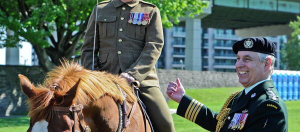 His Royal Highness Prince Andrew, The Duke of York shares a joke with Lt.-Col. Kevin Winiarski, a member of the ‘Old Guard’ of the Queen's York Rangers, during a parade at the Fort York National Historic Site in Toronto on June 05, 2014 - Sputnik International