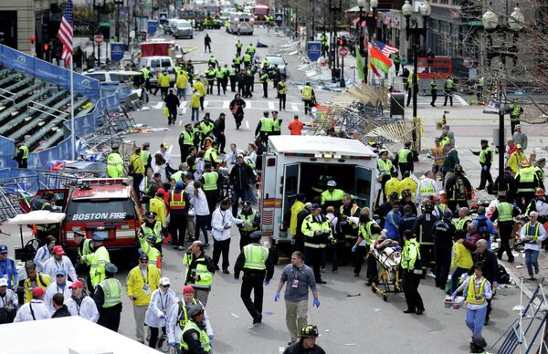 Medical workers aid injured people at the finish line of the 2013 Boston Marathon following an explosion. Medical workers aid injured people at the finish line of the 2013 Boston Marathon following an explosion. - Sputnik International