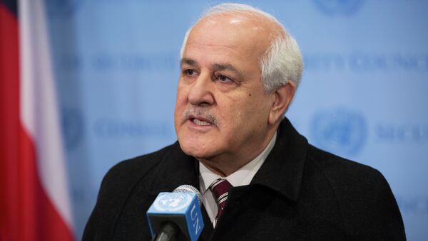 In this photo provided by the United Nations, Palestinian Ambassador to the U.N. Riyad Mansour addresses the media at U.N. headquarters after submitting documents to join the International Criminal Court on Friday, Jan. 2, 2015. The Palestinians moved quickly to join the court after suffering a defeat in the U.N. Security Council, which rejected a resolution Tuesday that would have set a three-year deadline for the establishment of a Palestinian state on lands occupied by Israel. - Sputnik International