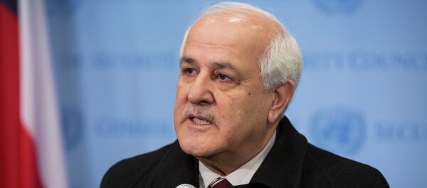 In this photo provided by the United Nations, Palestinian Ambassador to the U.N. Riyad Mansour addresses the media at U.N. headquarters after submitting documents to join the International Criminal Court on Friday, Jan. 2, 2015. The Palestinians moved quickly to join the court after suffering a defeat in the U.N. Security Council, which rejected a resolution Tuesday that would have set a three-year deadline for the establishment of a Palestinian state on lands occupied by Israel. - Sputnik International