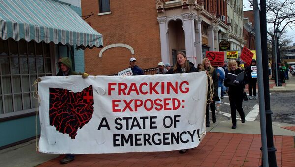 Ohio residents took to the streets to protest hydraulic fracturing, or fracking, the oil and gas drilling process expanding across the state, after a series of earthquakes were felt areas near fracking wells in March, 2014. - Sputnik International